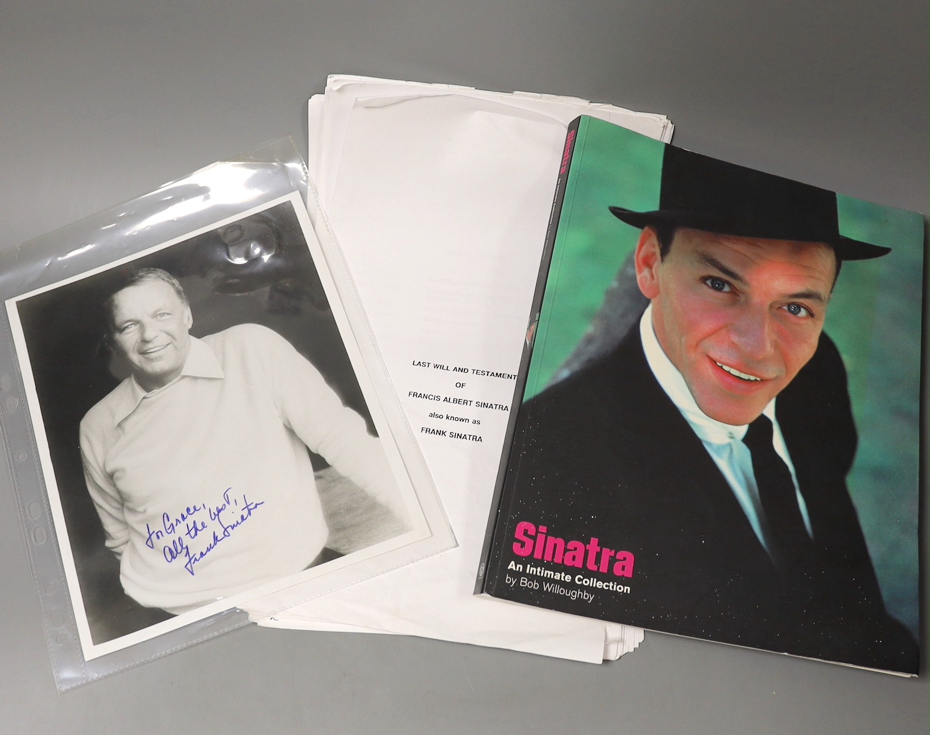 A photo of Sinatra, signed by him, along with a book on him and a copy of his will.